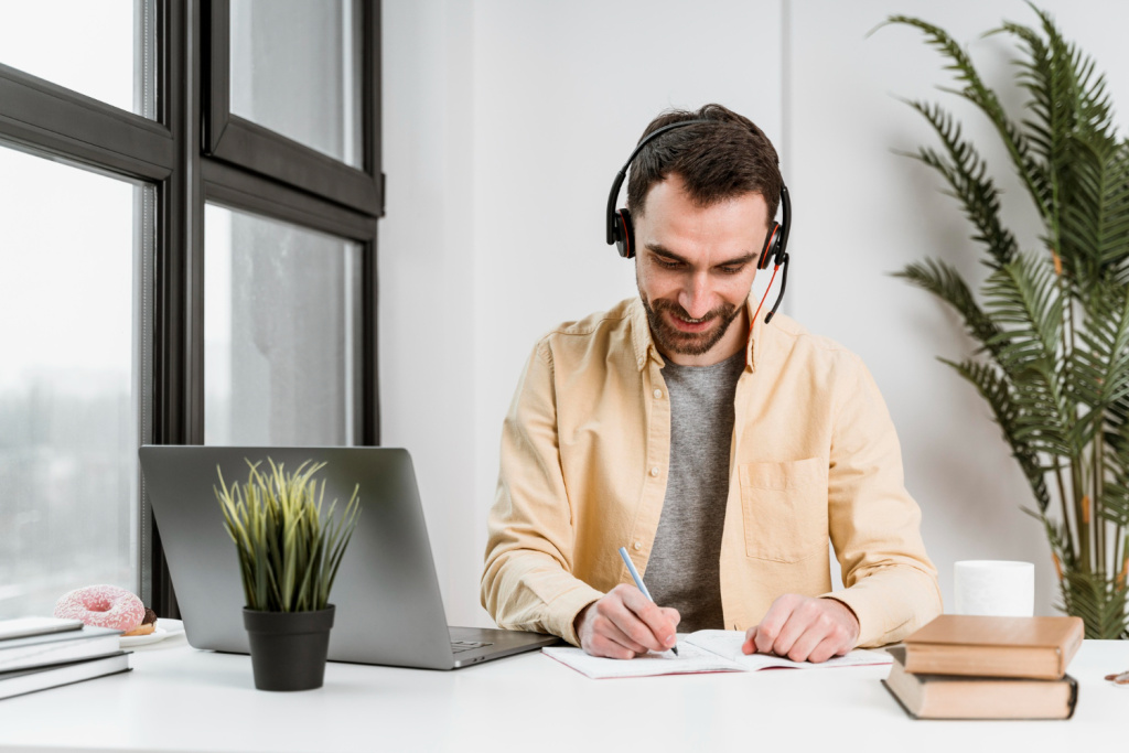 man-with-headset-having-video-call-laptop.jpg man-with-headset-having-video-call-laptop.jpg